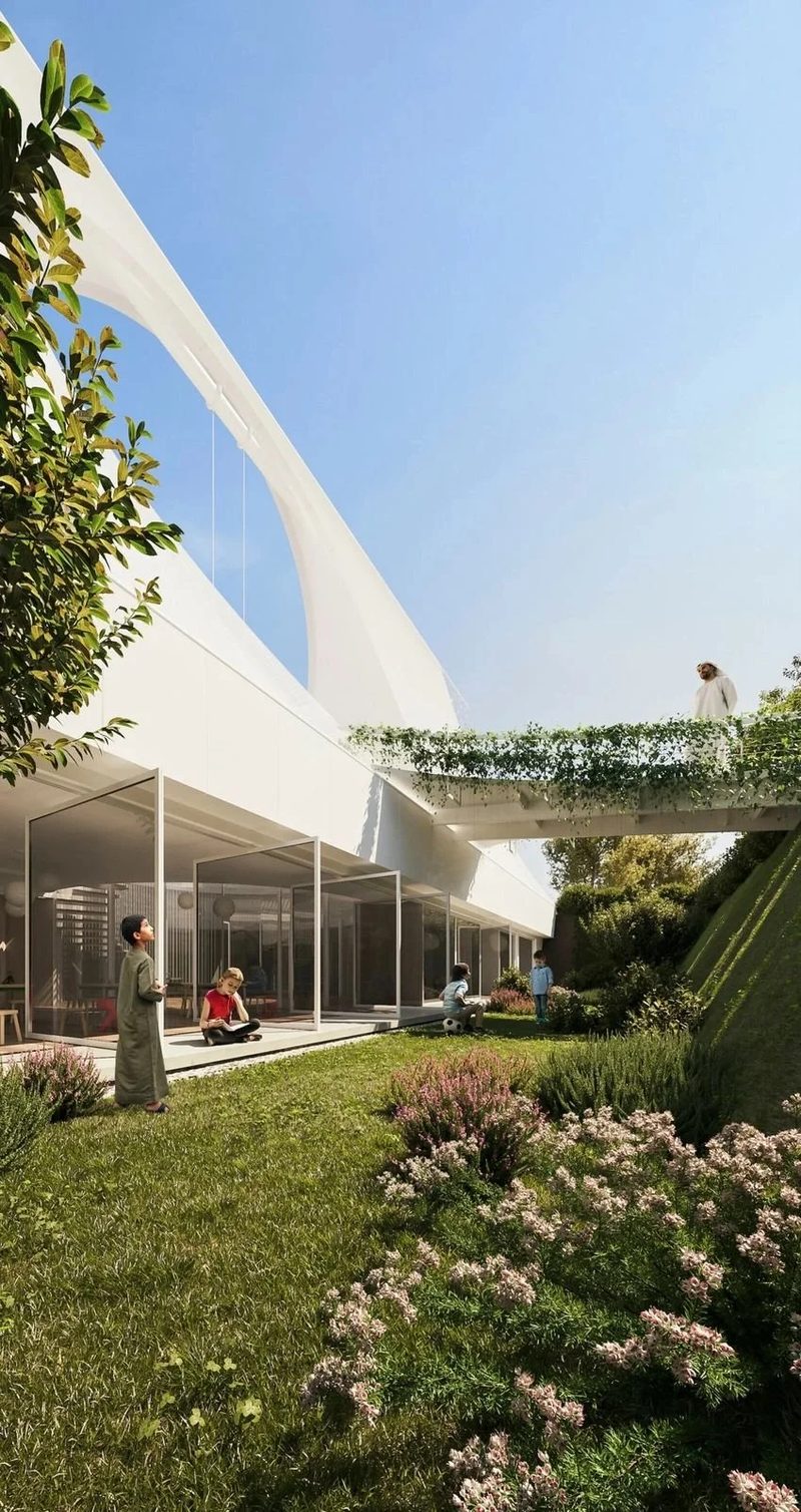 Al Wasl Nursery · UAE — the tent edge rising over planting and a glass classroom