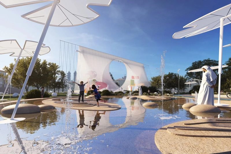 Al Wasl Nursery · UAE — children playing by the water under white canopies, the tent beyond