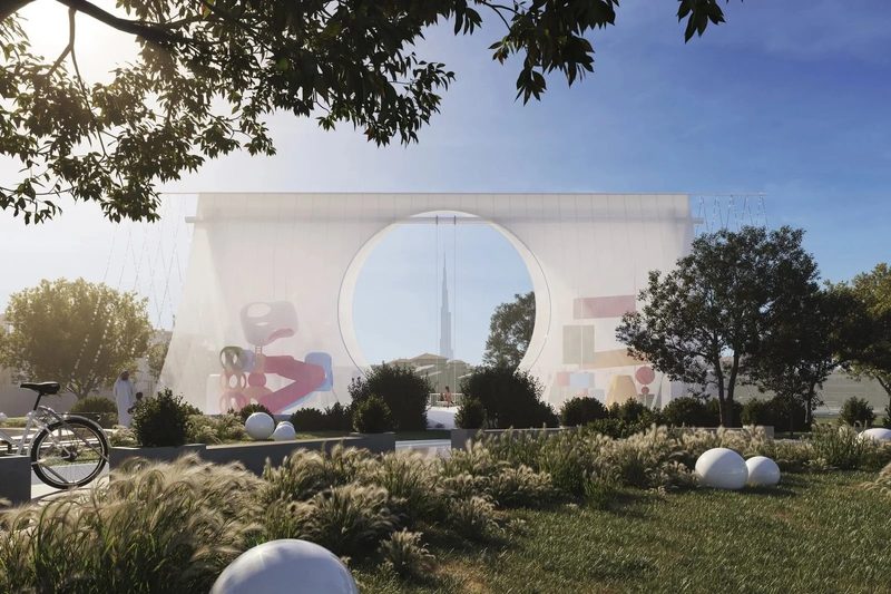 Al Wasl Nursery · UAE — the tent behind trees and tall grass, round opening framing the sky