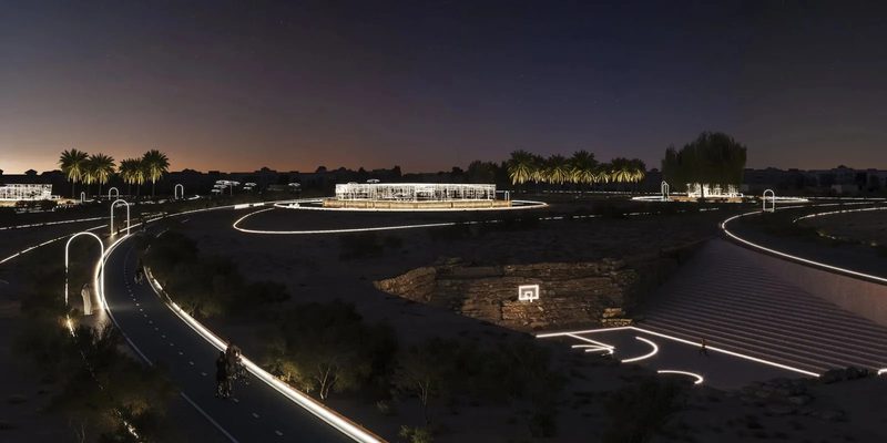 Jumeirah Archaeological Square · Jumeirah — the square lit at dusk, paths curving through it