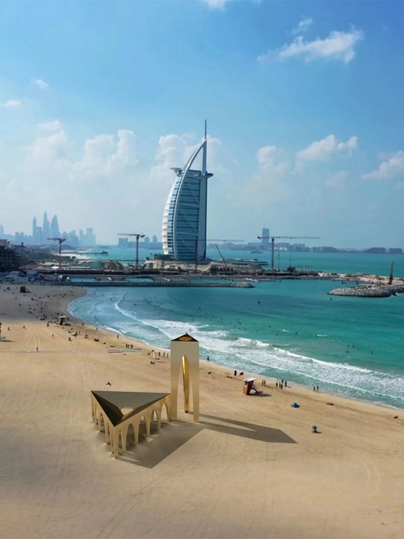 Pop-up Mosque · UAE — model of the folded mosque on a beach, a hotel tower behind
